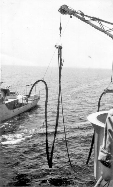 Fueling HMS Magpie or Peacock from HMS Gambia, 1950