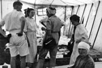 Lady Mountbatten, Commandant of the St Johns Ambulance Brigade, talking to Greek nurses in a medical tent set up by HMS Theseus' medical officer, August 1953. Image from Imperial War Museums, A32636