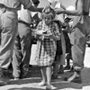 A child served with rations at a field kitchen, 'South Camp', Zante, August 1953. Image from Imperial War Museums, A32694