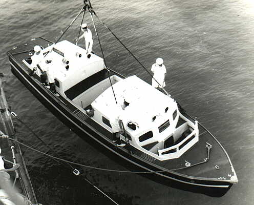 Hoisting the motor boat aboard - 1952