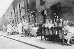 The end of WWII street party scene shows the houses opposite the Rodney Pub, Two Mile Hill, St. George. Photo from Bryan Bignell.