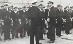 Inspection. HMS Warrior's captain is in the center of the front group