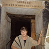 Patty, Catacombs, Paris, September 24, 2008. The sign above her head in English is Stop! This is the Empire of the Dead